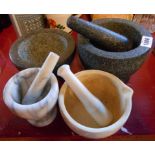 A large carved stone pestle and mortar, a similar mortar - sold with another two mortar and pestle