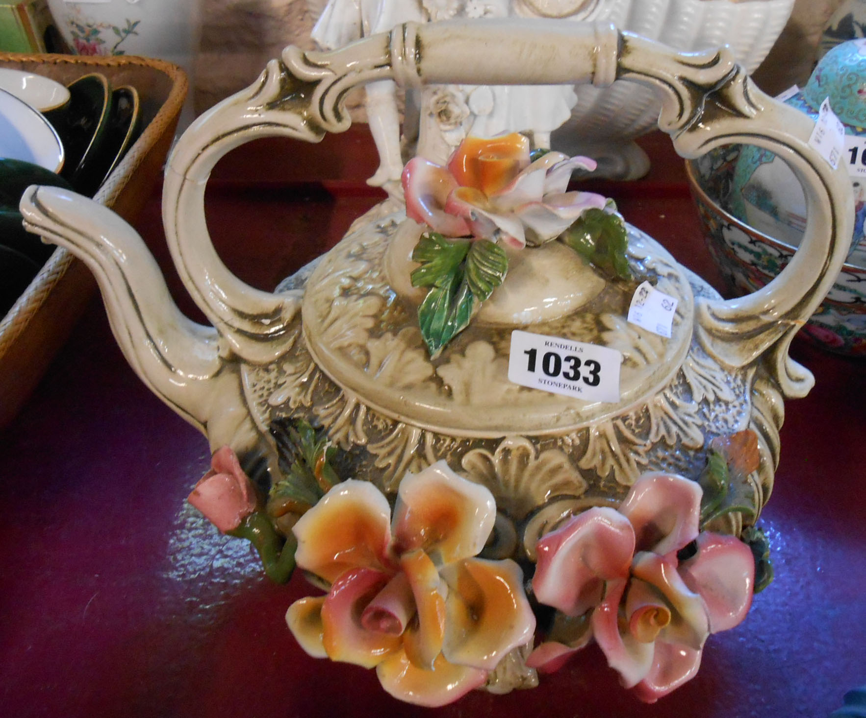 A large Capodimonte tea kettle with large applied floral decoration - a/f