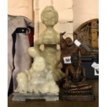 A large carved hardstone figurine depicting an Eastern gentleman - sold with a small carved