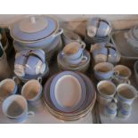 A large quantity of Royal Doulton bone china tea and dinner ware decorated with a baby blue band and