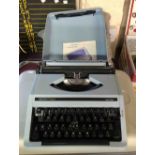 A vintage Boots PT400 portable typewriter in original hard plastic carry case