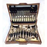A vintage oak canteen containing a quantity of assorted silver plated cutlery and ivorine handled
