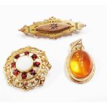 A 375 (9ct.) gold mourning brooch - sold with a 375 garnet and opal panel brooch and a 375 (9ct.)