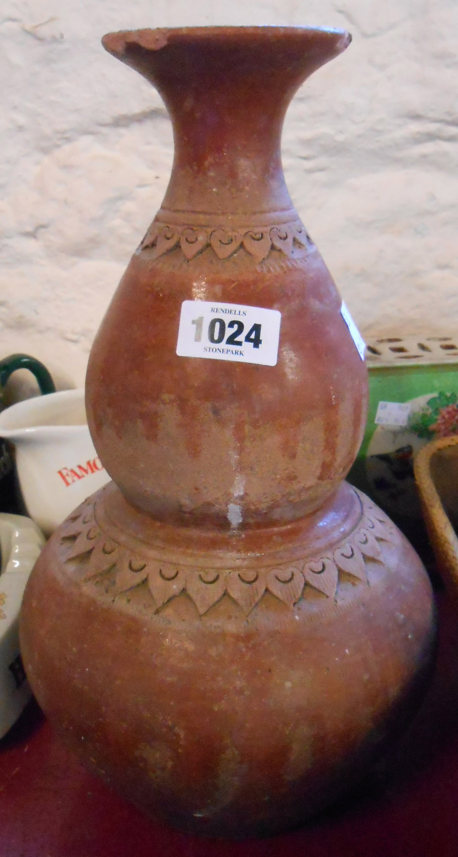 An old Turkish vase of double gourd form with frieze decoration