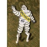 A modern painted cast iron Michelin Man double coat hook