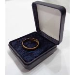 A 22ct. gold wedding band - size R