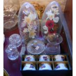 A small quantity of assorted glassware including glass domes set with flowers and butterflies, cut