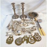 A box containing a quantity of silver plated items including a pair of candlesticks, wine coaster,
