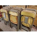 Thirty two matching Samsonite folding chairs with typical moulded plastic backs and seats and