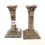 A pair of 16cm Mappin & Webb silver plated Corinthian column candlesticks