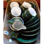 A basket containing a green glazed French part coffee set