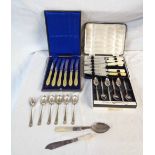 A bag containing cased sets of silver plated cutlery and other loose cutlery