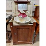 A 56cm Victorian stained oak washstand with internal mirror top lift-top and panelled cupboard