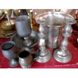 A small selection of pewter items including candlesticks, bowl, goblets and measures - sold with a