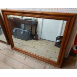 A modern stained pine framed oblong wall mirror - 1.22m X 93cm