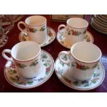 A set of four late 20th Century Wedgwood Queen's Ware coffee cans and saucers in the Provence