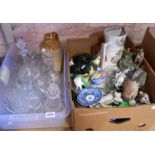 A crate and a box containing a quantity of assorted ceramic items and glassware including decanters,