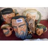 Three large and two small Royal Doulton character jugs comprising The Lawyer, Golfer, Merlin,