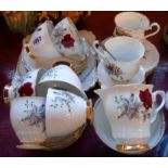 A Royal Stafford bone china part tea set in the Roses to Remember pattern - sold with two bone china