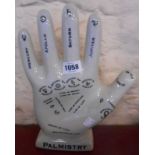 A modern ceramic palmistry hand with crackle glaze finish