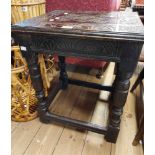 A 48cm antique oak side table with carved decoration to top, set on an open stretcher base with