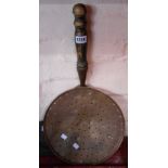 A large antique copper skimmer with wrought iron strapwork and turned wooden handle