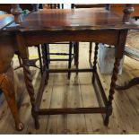 A 61cm 1920's stained oak occasional table, set on barley twist supports