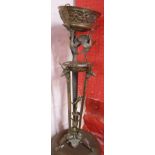 An Italian ornate bronze centrepiece/torchere with stork and stag's head mounts and signature to