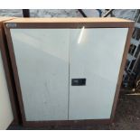 A Euro two door metal locking stationery cabinet