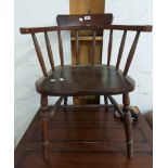 An old stained beech and mixed wood stick back smoker's bow elbow chair with moulded solid elm seat,