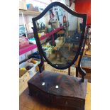 A 1920's flame mahogany veneered platform dressing table mirror with shield shaped plate and two