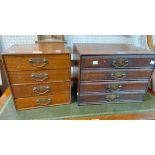 Two late Victorian stained mixed wood table-top four drawer file chests with shaped backplate drop