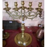 A large old cast brass five branch candelabrum with pierced stag decoration