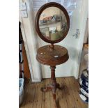 A late Victorian stained mixed wood gentleman's washstand with telescopic circular swing mirror over