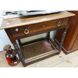 A 72cm Victorian oak side table with Gothic style brass drop-handles to frieze drawer, set on an