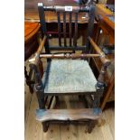 An antique stained wood child's high chair with woven rush seat panel a/f