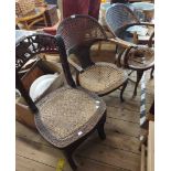 A pair of early 20th Century stained beech framed curved back elbow chairs with remains of rattan
