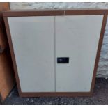 A Euro two door metal locking stationery cabinet