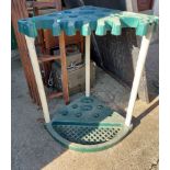 A modern plastic freestanding corner garden tool tidy