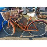 A vintage Puch Touring lady's bicycle with front mounted wicker basket