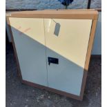 A Euro two door metal locking stationery cabinet - with keys