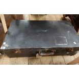 A large vintage fibreboard suitcase with corroded latches