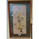 A framed embroidery picture, depicting an Oriental style flowering branch - sold with framed