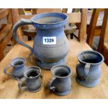A set of Victorian graduated pewter measures of tankard form