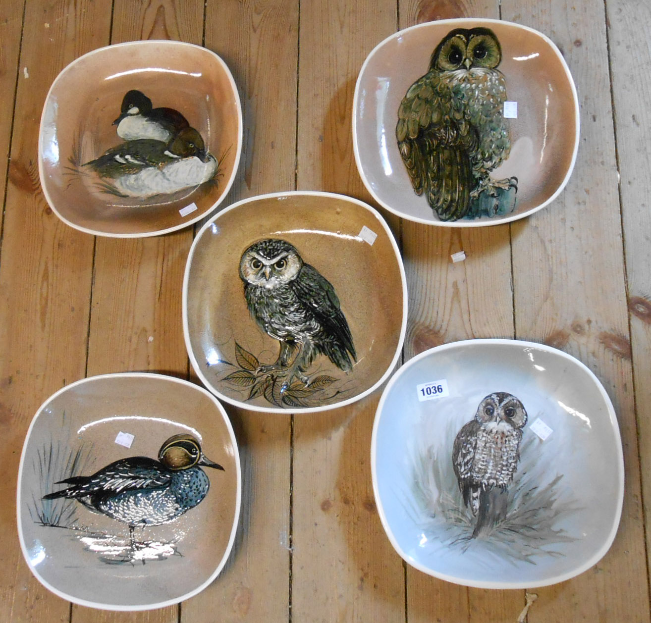 Five large Stuart Bass (Exmoor) pottery squared oval dishes, each decorated in sgraffito and slip