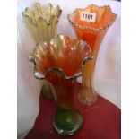 A Carnival glass tall vase with green and marigold shaded finish - sold with two similar examples,
