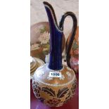 A Doulton & Slater's Patent stoneware jug with tube lined and textured floral decoration and a