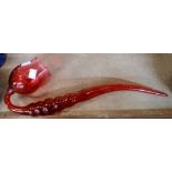 A large Victorian novelty cranberry glass pipe with fold-over rim and ribbed stem - a/f to