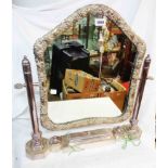A vintage ornate silver plated framed platform dressing table mirror with cast floral scroll