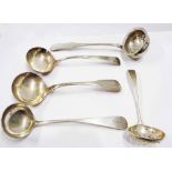A Scottish silver small ladle and strainer ladle - sold with two antique English silver ladles and